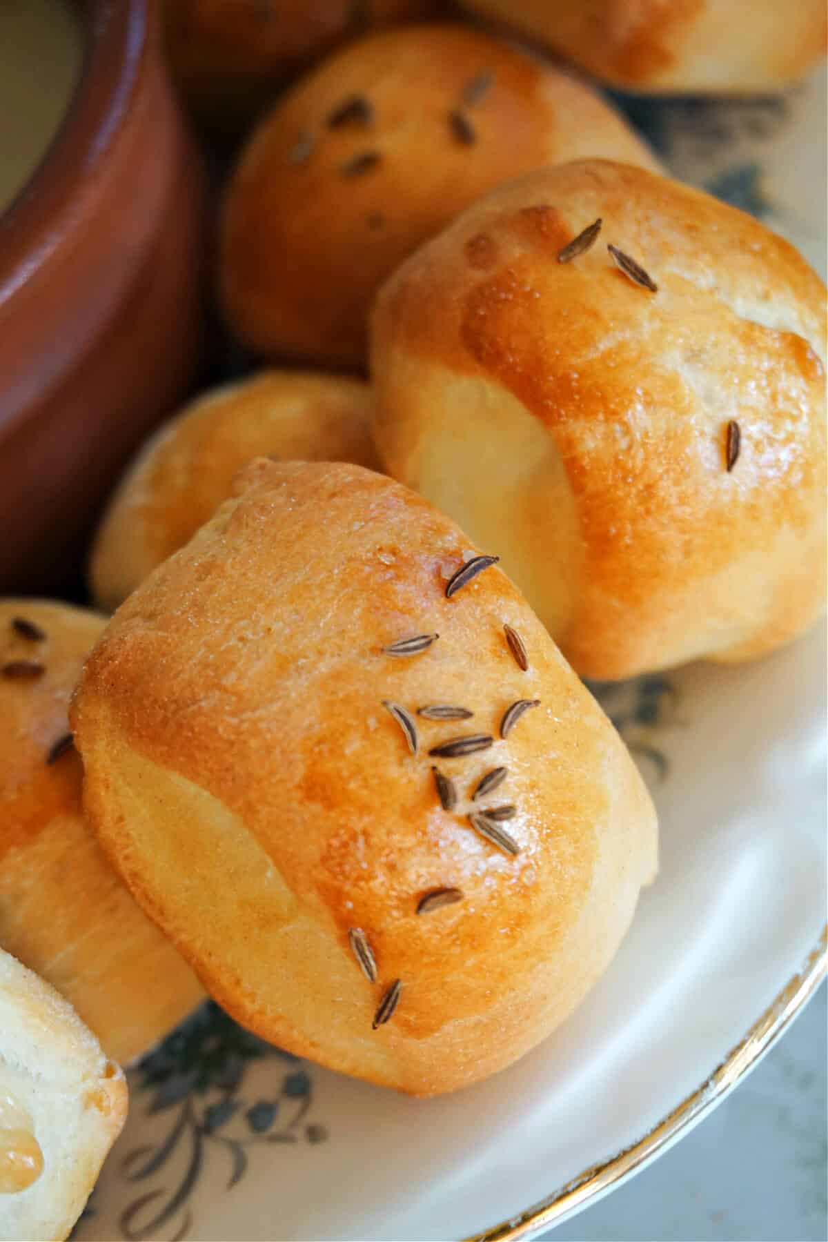 Close-up of pretzel bites with caraway seeds on top.