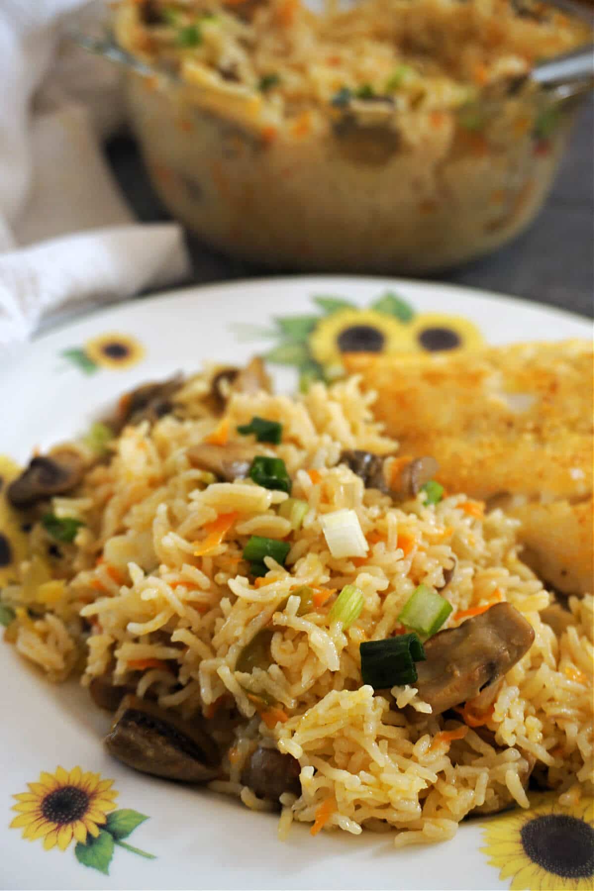 Close-up shot of vegetable rice on a plate.