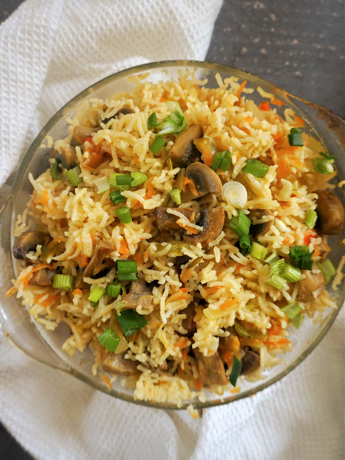 A casserole dish with vegetable rice.