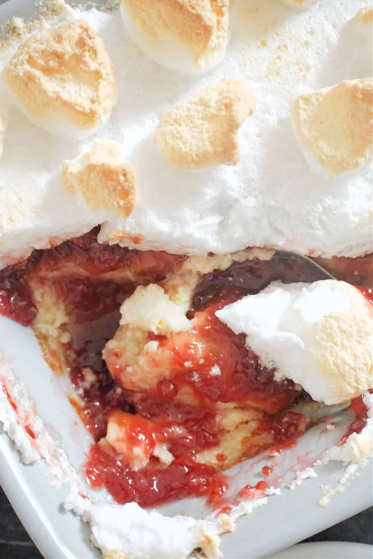 Close-up shot of a dish with queen of puddings.