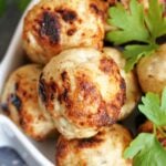 Close-up shot of meatballs garnished with parsley leaves