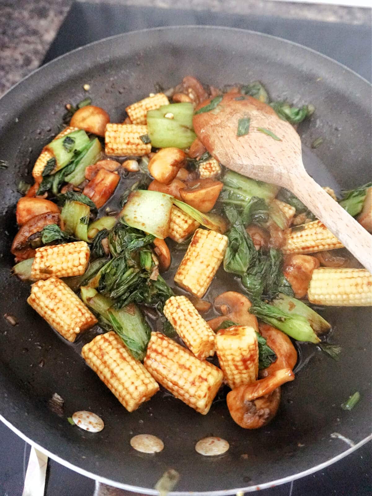 A pan with vegetable stir fry.