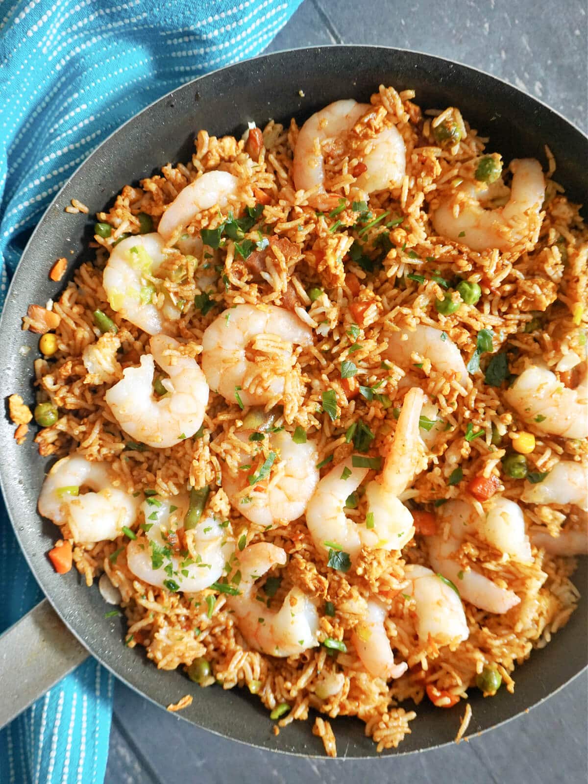 Overhead shot of a pan with prawn fried rice.