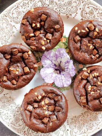 Overhead shot of a plate with 5 muffin-shaped brownies