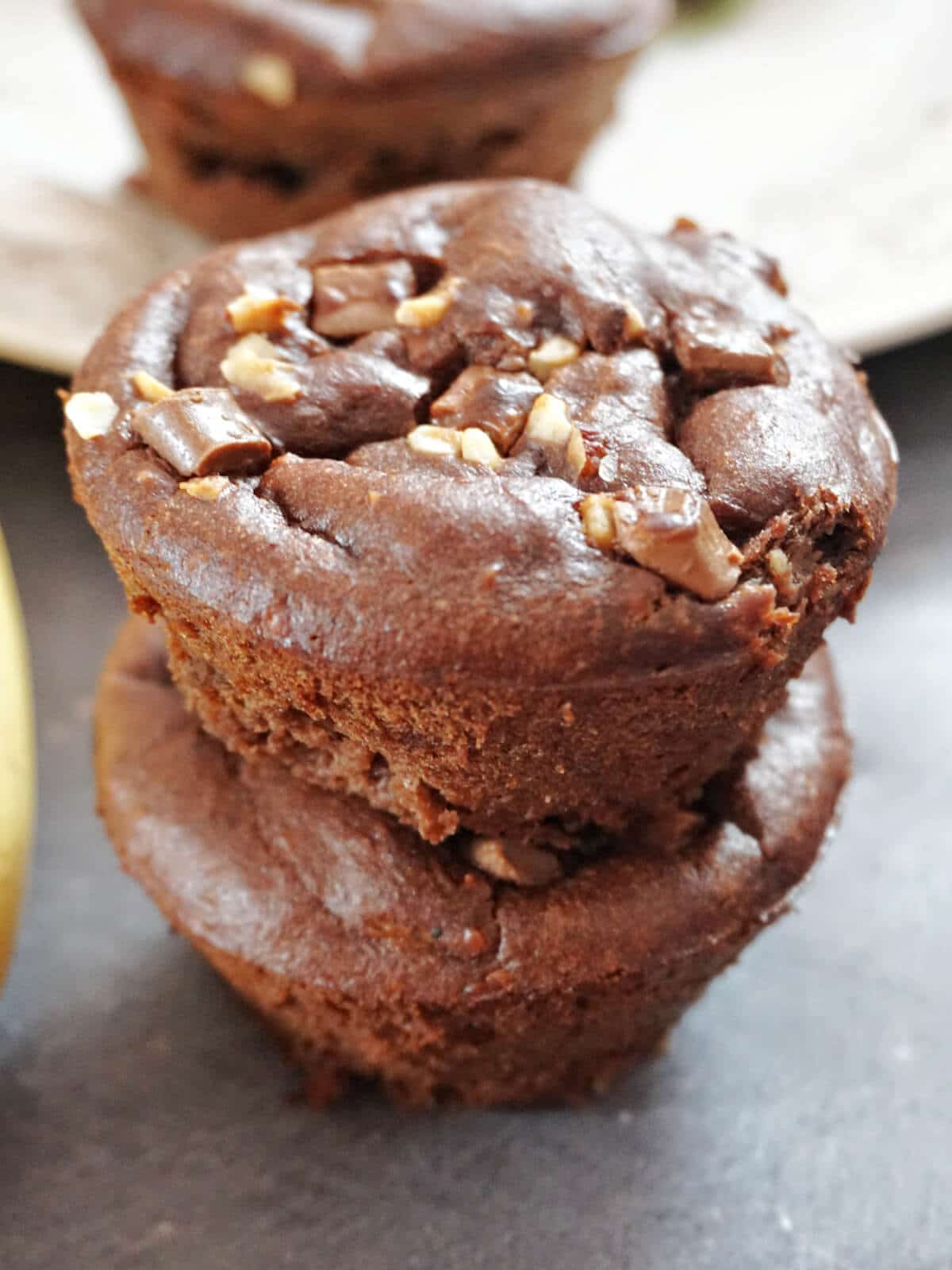 A stack of 2 muffin-shaped brownies.