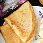 2 folded crepes on a white plate.