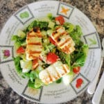 Overhead shoot of a plate with grilled halloumi salad