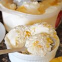A white ramekin with 3 scoops of ice cream
