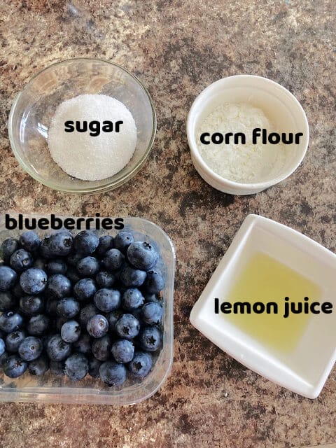 Overhead shot of 4 ingredients for the blueberry pie filling.