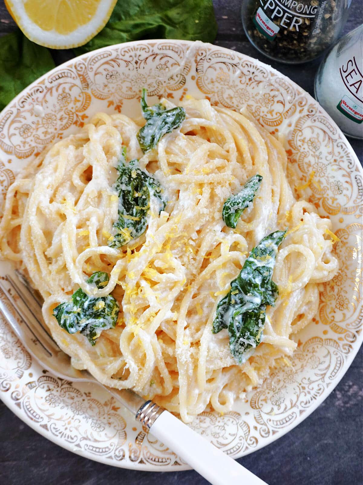 Overhead shot of a bowl with spaghetti with lemon, ricotta and spinach.
