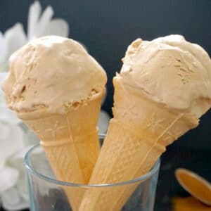 2 cones of coffee ice cream in a glass