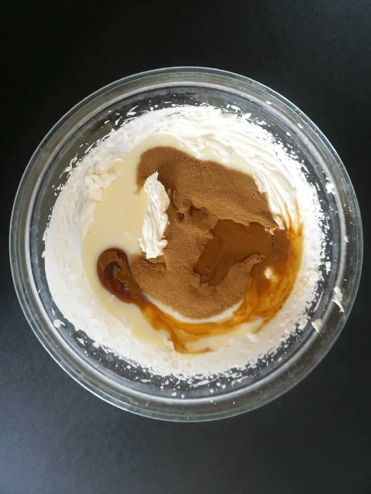 A bowl with ingredients to make coffee ice cream.