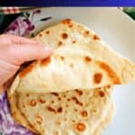 A pile of flatbreads on a plate.