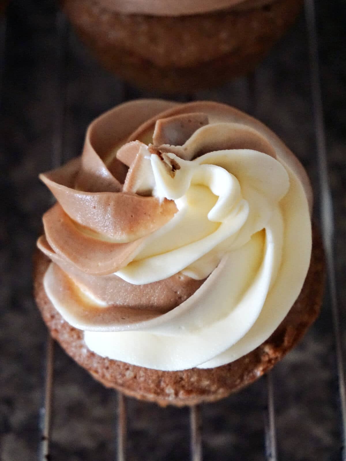 Close-up shot of a cupcake top that has duo icing