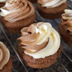 Close-up shot of duo-buttercream cupcakes on a cooling rack