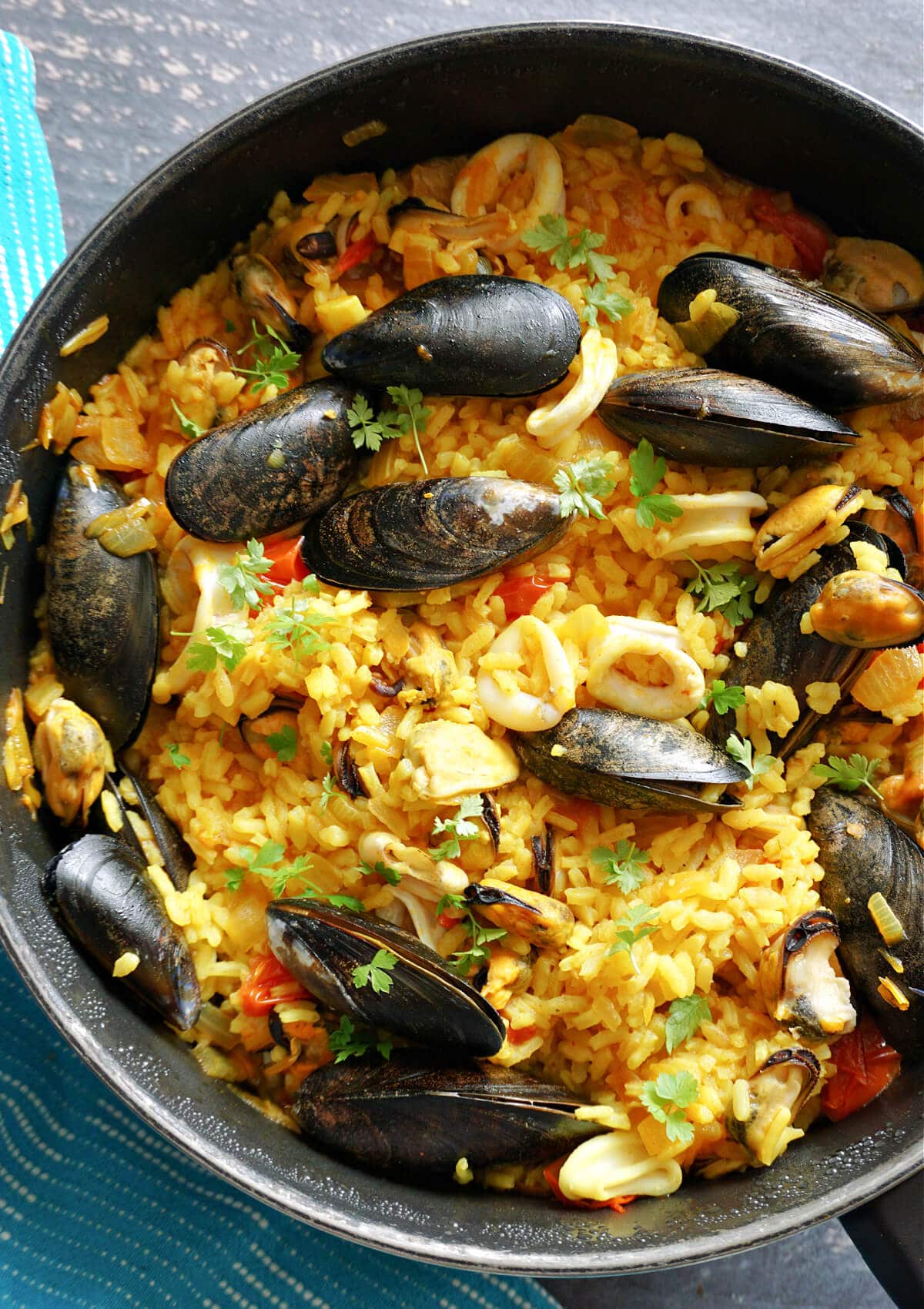 Overhead shot of a pot with seafood paella.
