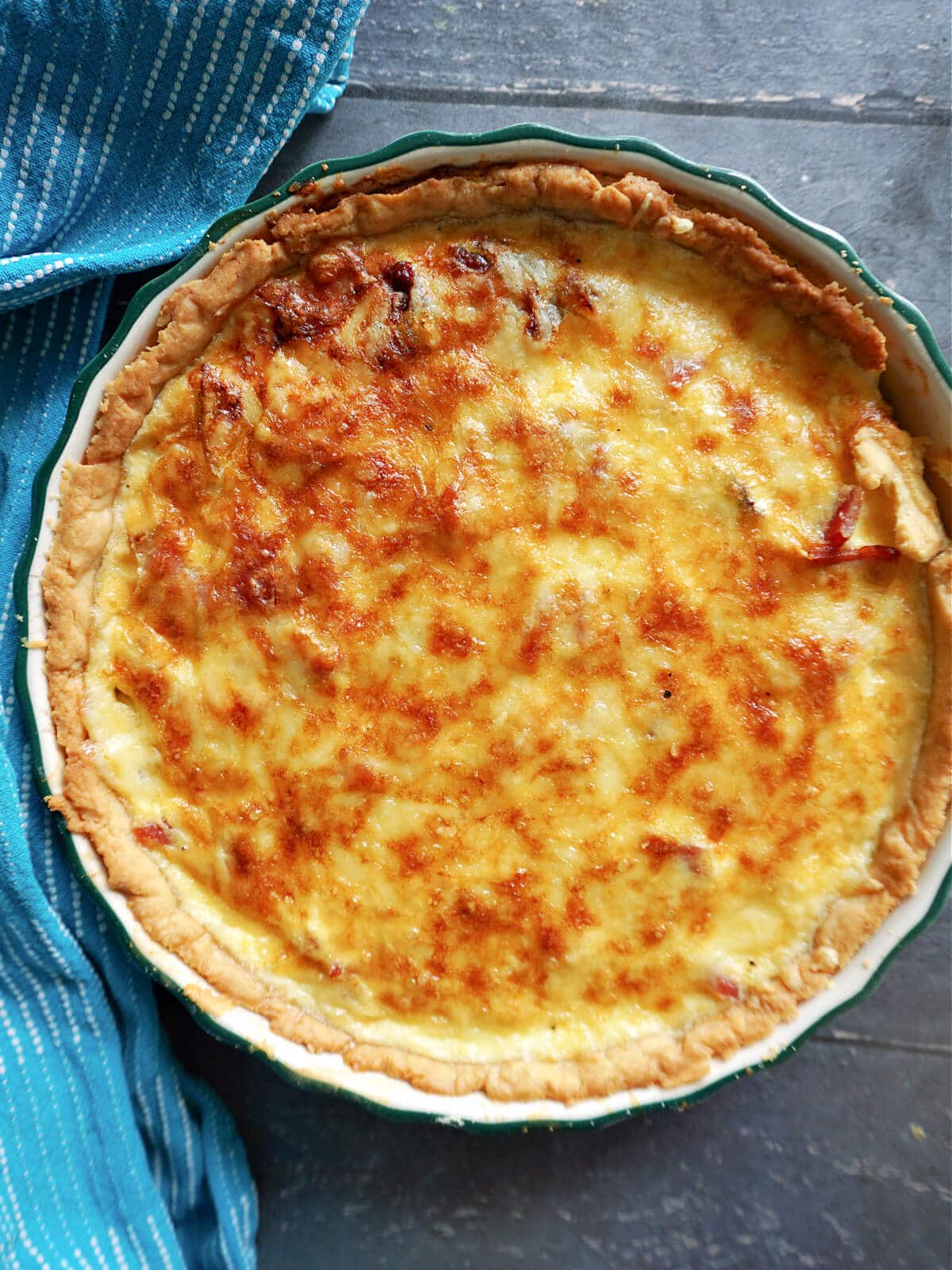 Overhead shot of a quiche in a tin.