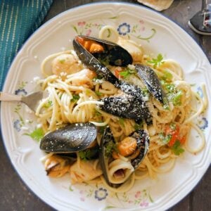 A white plate with seafood spaghetti