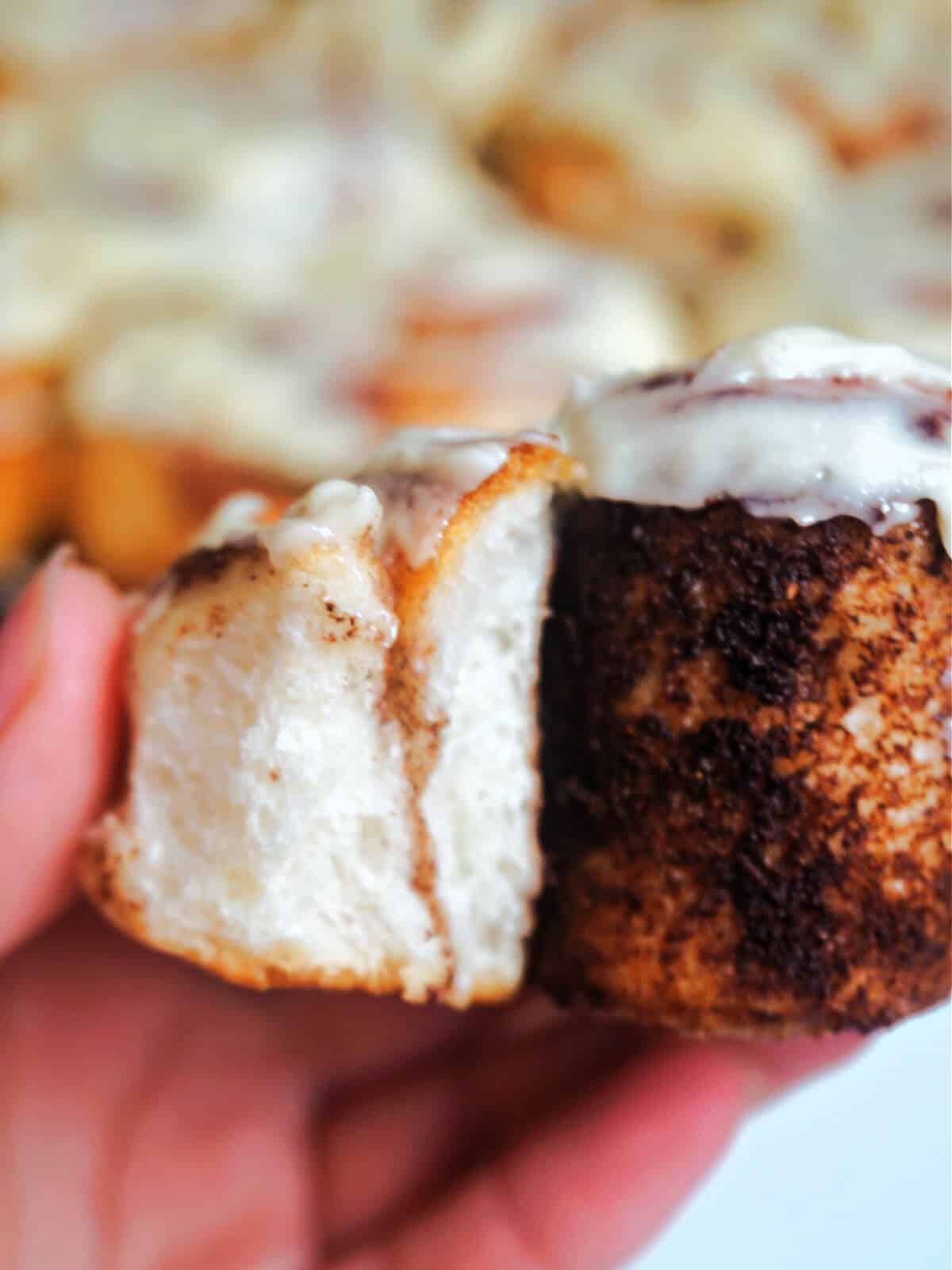 Half of a cinnamon roll to show how fluffy is inside.