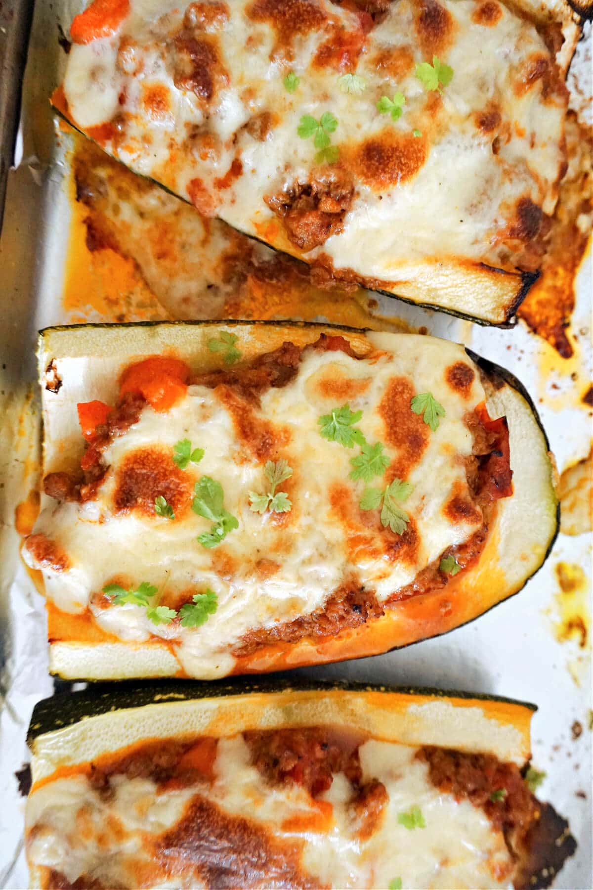 Overhead shoot of 3 quarters of stuffed squash.