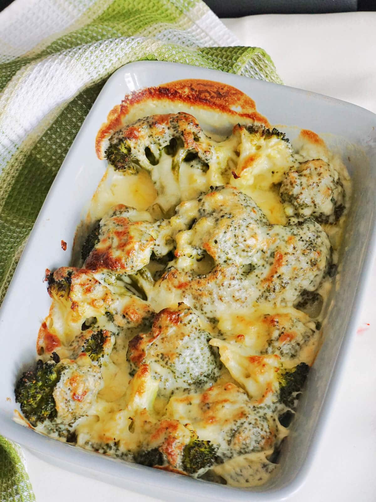 A dish with baked broccoli cheese