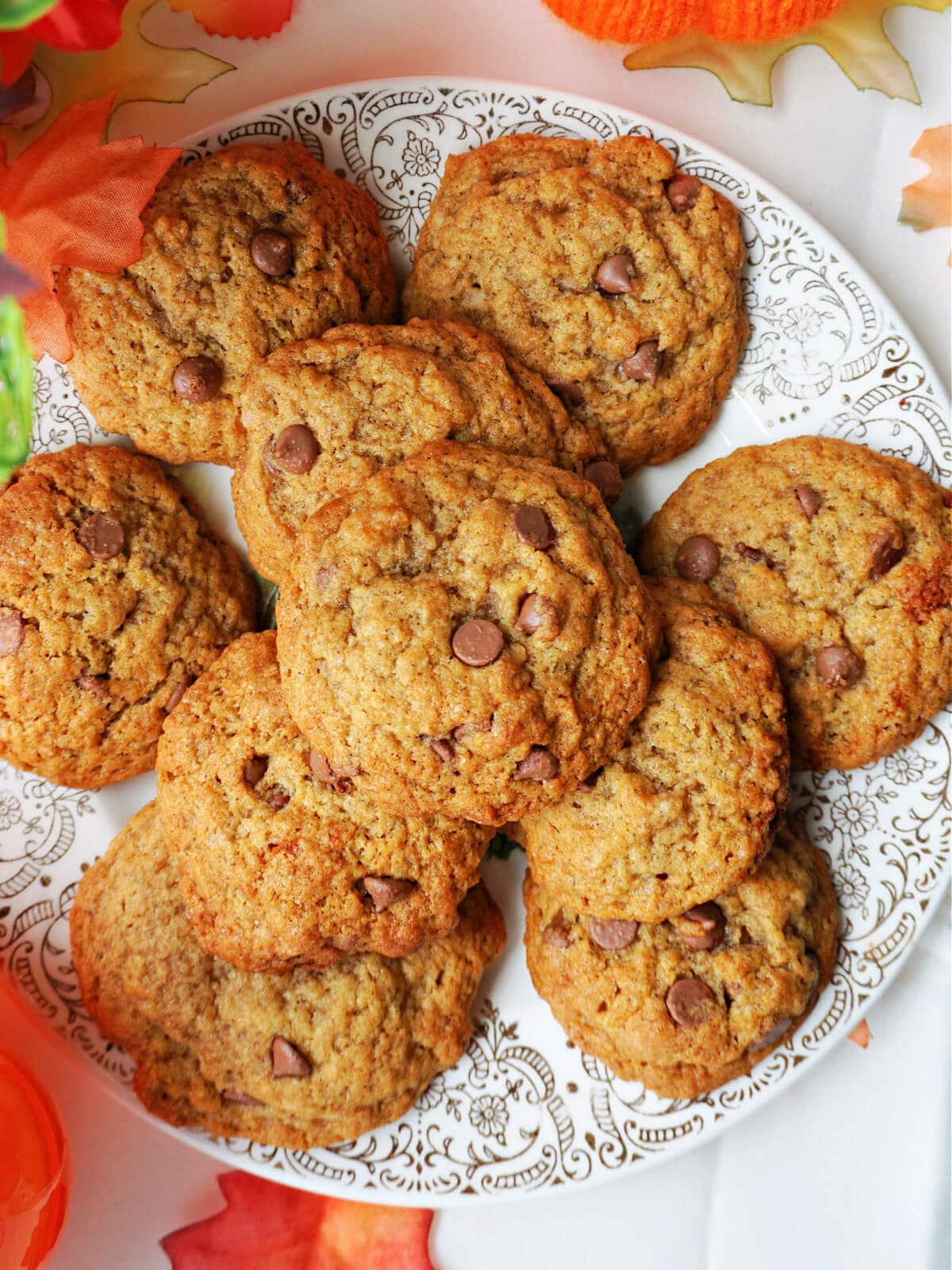 Close-up shoot of a pile of pumpkin and chocolate chips cookies.