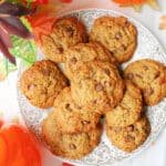 Overhead shoot of a plate with pumpkin cookies with chocolate chips