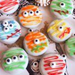 8 monster cookies on a plate