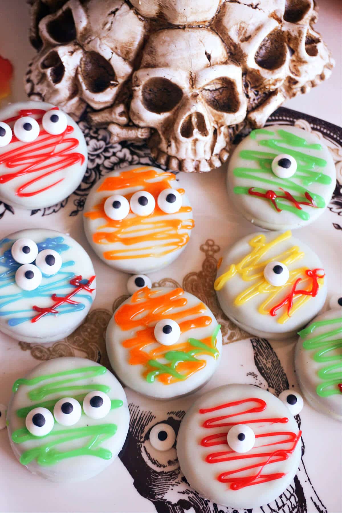 9 monster cookies with skull decorations at the top.