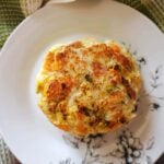 A white plate with a bubble and squeak patty