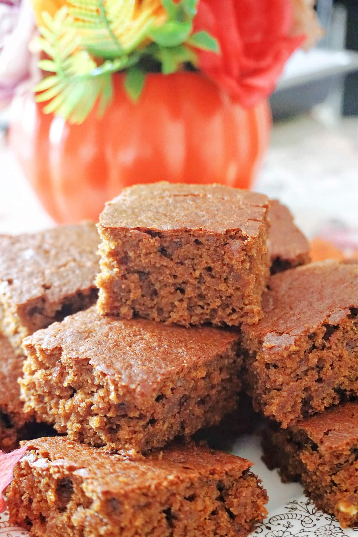 A stack of ginger cake slices on a plate