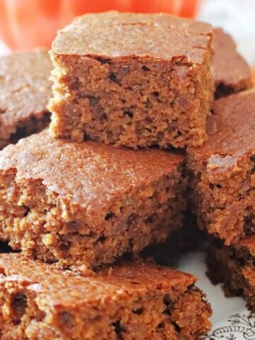 A stack of gingerbread cakes on a white plate