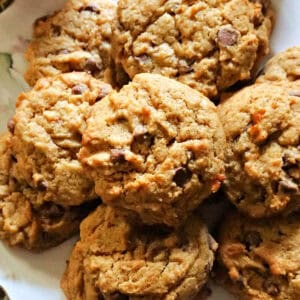 A plate with chocolate chip cookies.