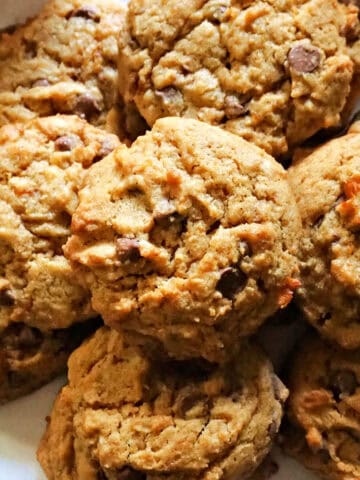 A plate with chocolate chip cookies.