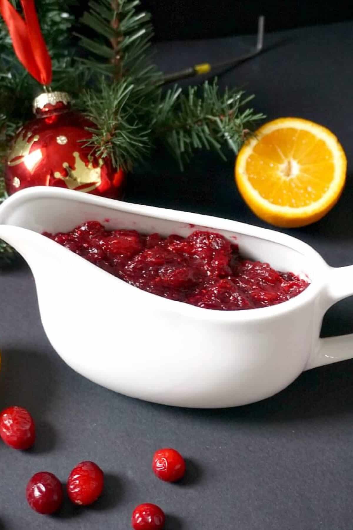 A white bowl with cranberry sauce.