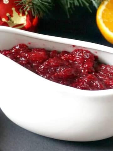 A white bowl with cranberry sauce