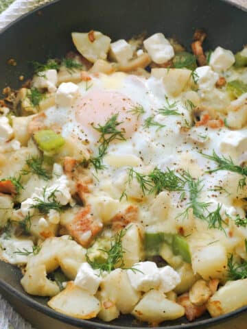 A pan with hash and eggs