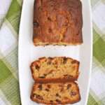 Overhead shoot of a white rectangle plate with a loaf cake