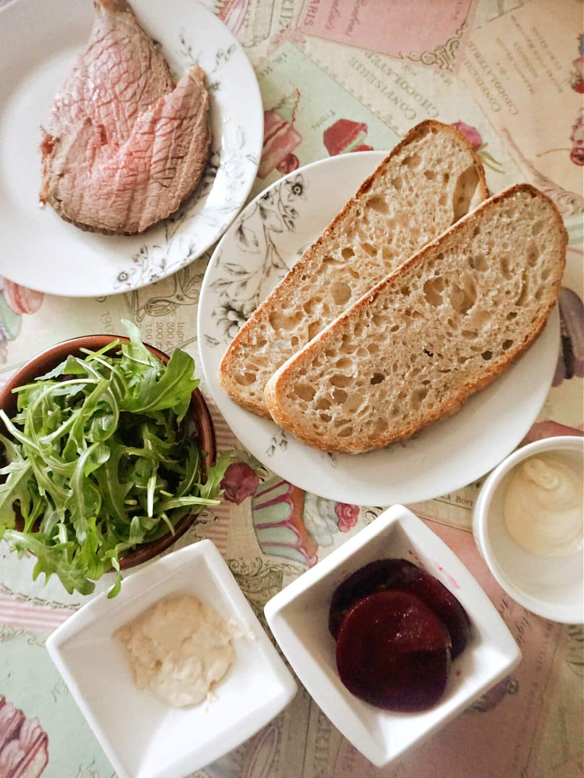 Overhead shoot of ingredients needed for a beef sandwich.