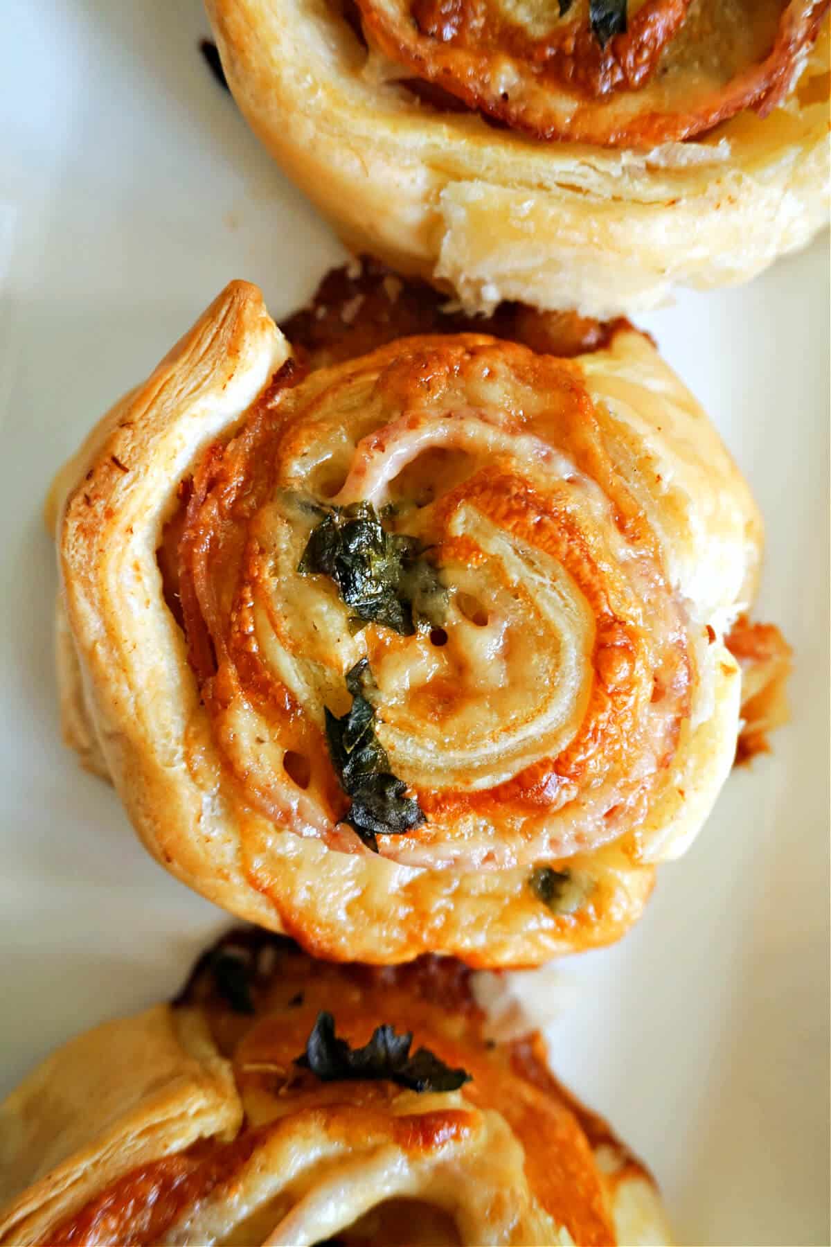 Close-up shoot of a ham and cheese pinwheel.