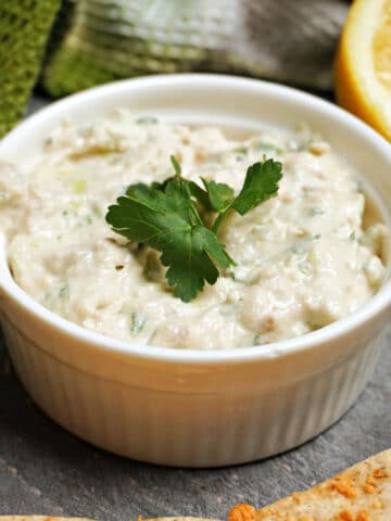 A white ramekin with kipper pate