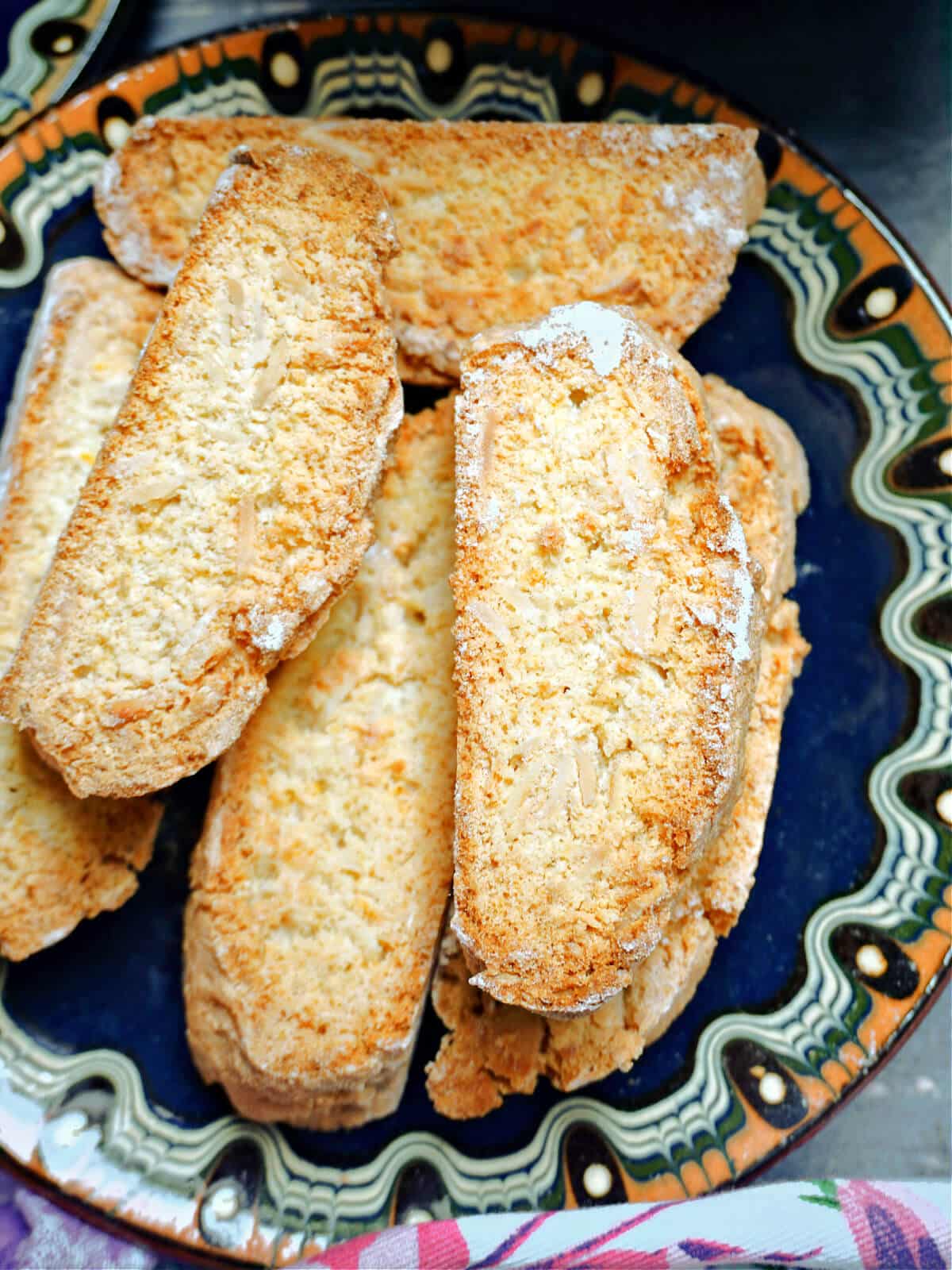 Close-up shoot of a dark blue plate with biscotti.