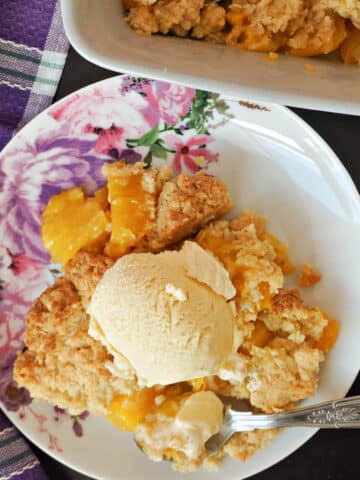 Overhead shoot of a plate with a portion of crumble and a scoop of ice cream