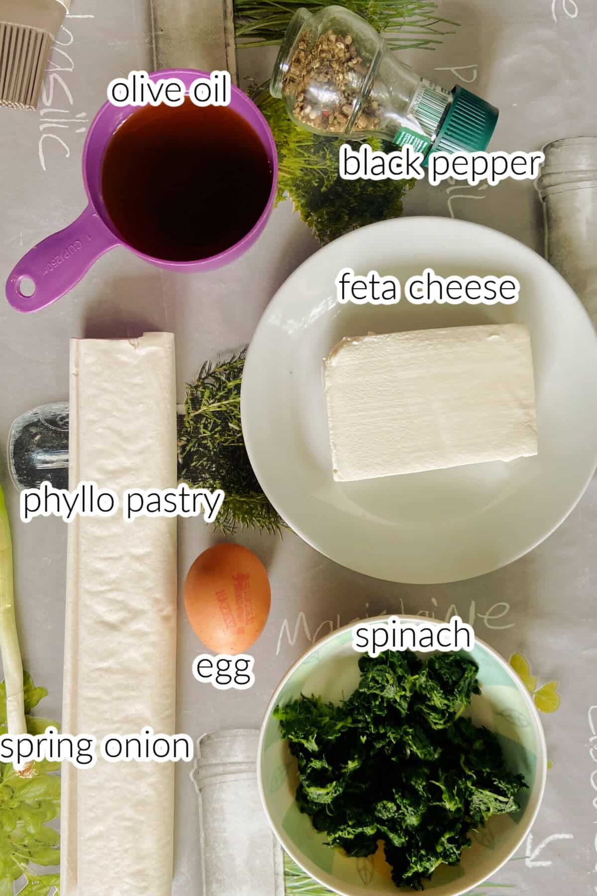 Ingredients needed to make Greek spanakopita.