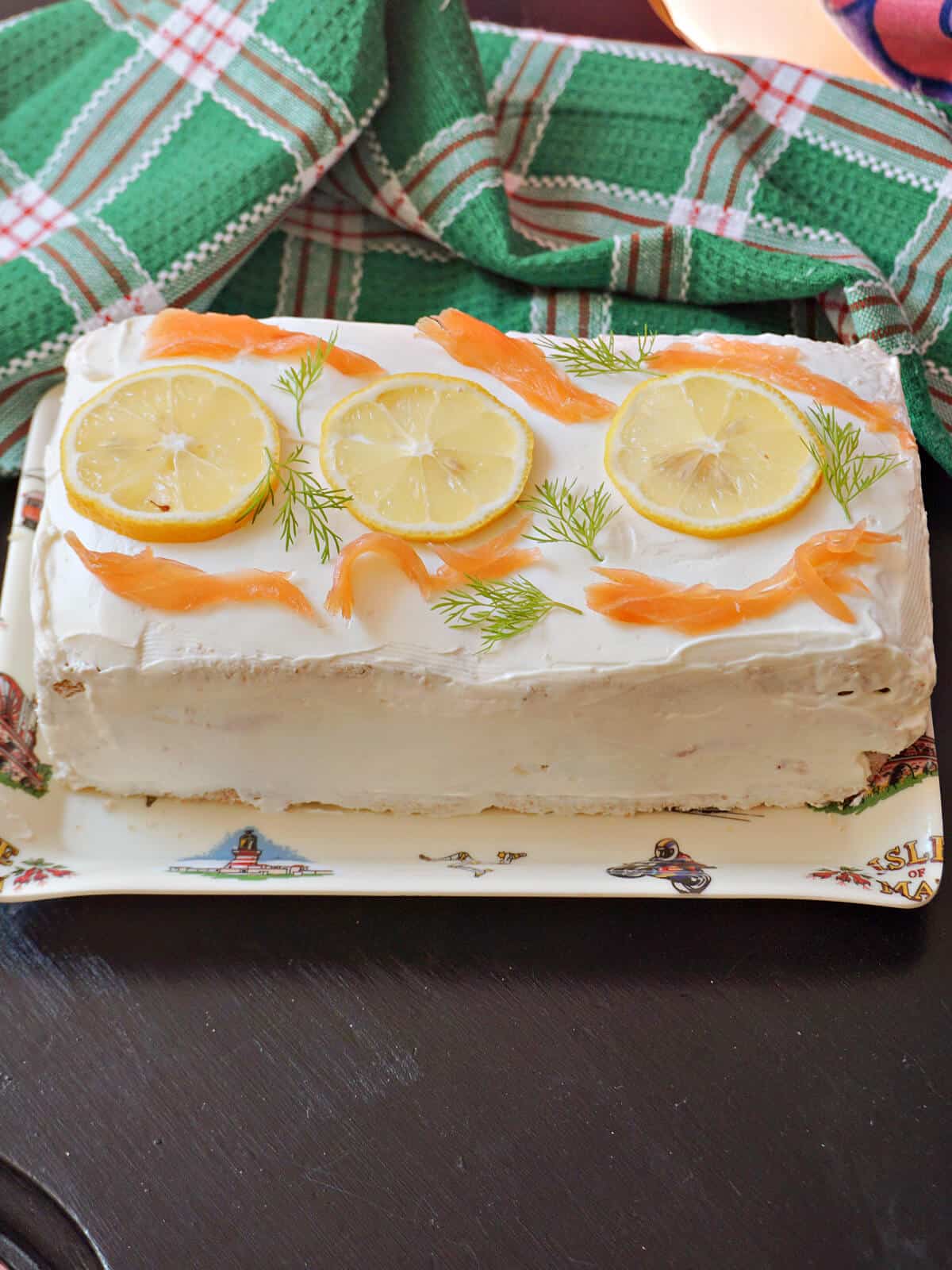 A sandwich cake on a serving tray