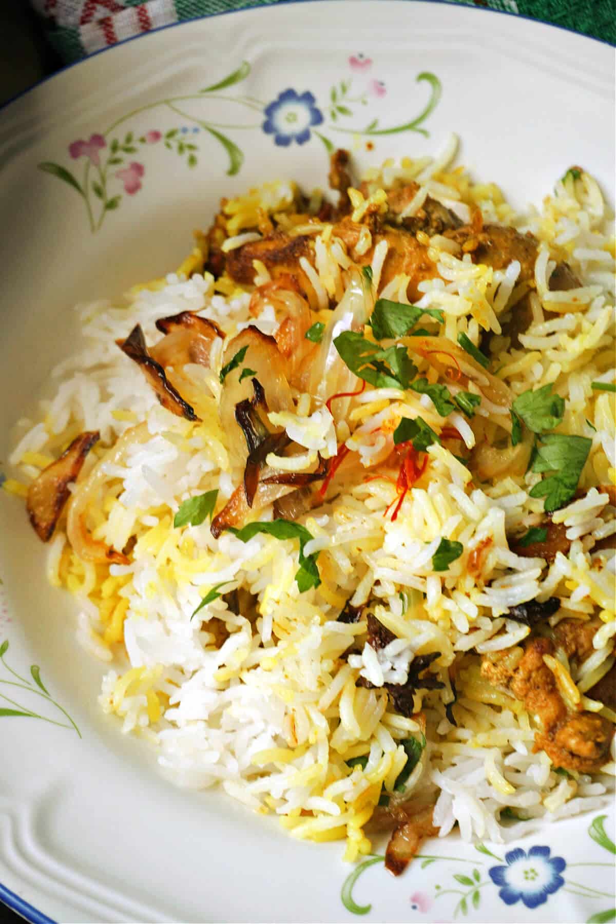 A plate with chicken biryani.