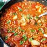 A pot with lentil and chorizo stew.
