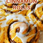 Close-up shoot of pumpkin cinnamon rolls with icing.