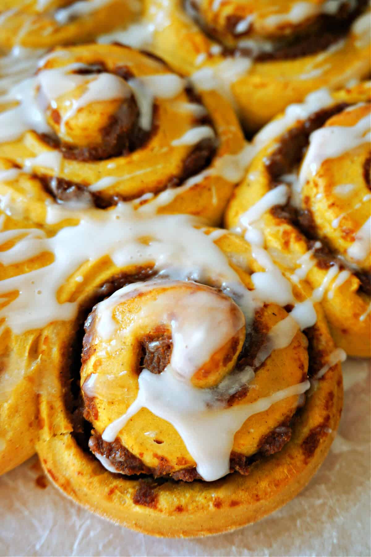 Close-up shoot of pumpkin cinnamon rolls.