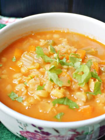 A bowl with yellow split pea soup